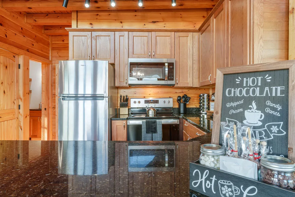 Full kitchen with stainless steel refrigerator, range, microwave, and dishwasher