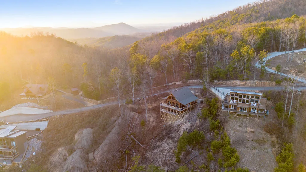 Sunrise over the Great Smoky Mountains with fog settled in the valleys below the cabin